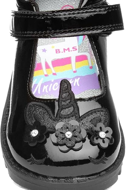 Buckle My Shoes black patent school shoes with star and flower embellishments
