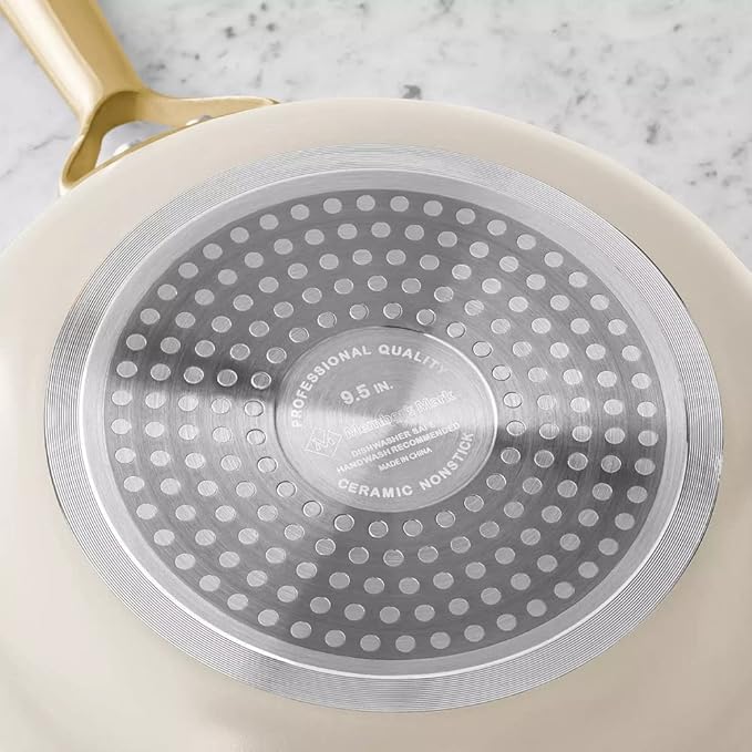 Member's Mark cream ceramic frying pan with 9.5 inch base and gold handle