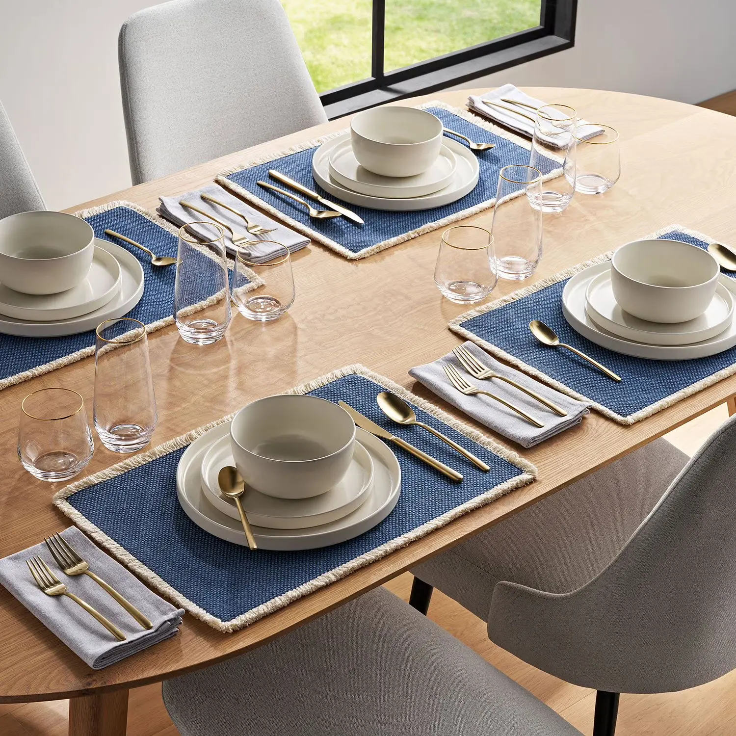 Member's Mark Premium matte gold 20 piece flatware set displayed on dining table