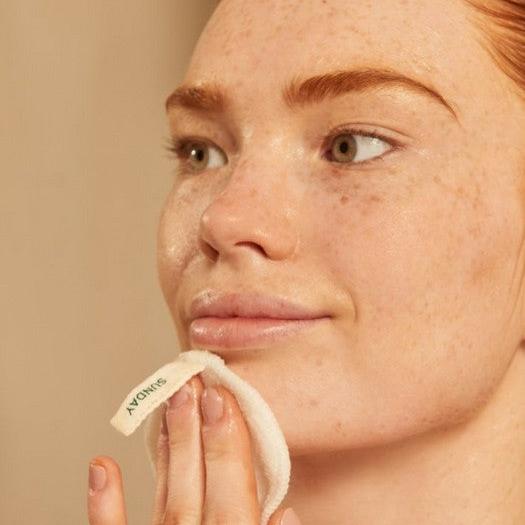 The Body Shop Vitamin C Glow Revealing Liquid Peel exfoliant on pad
