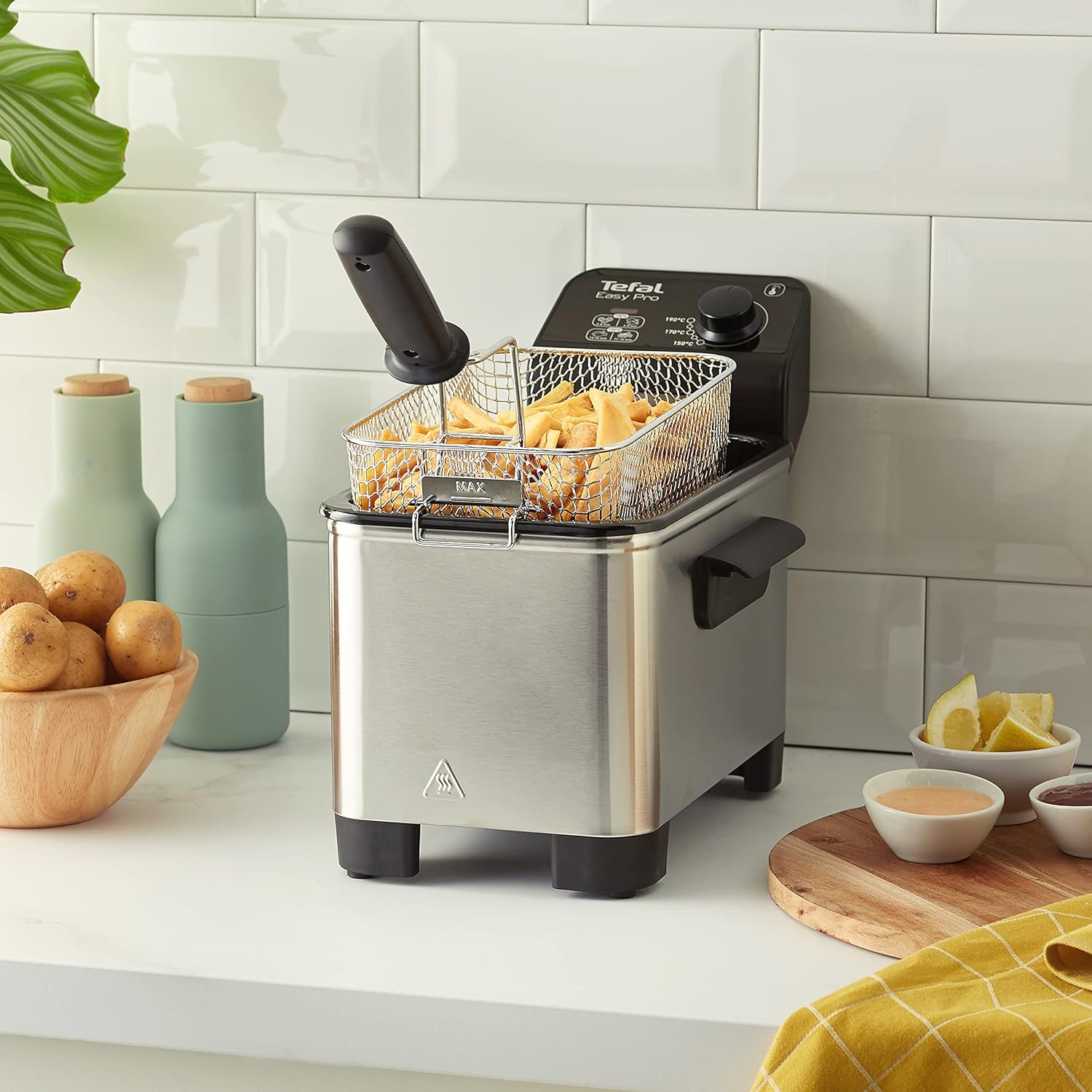 Tefal Easy Pro stainless steel deep fryer with basket and cooked chips