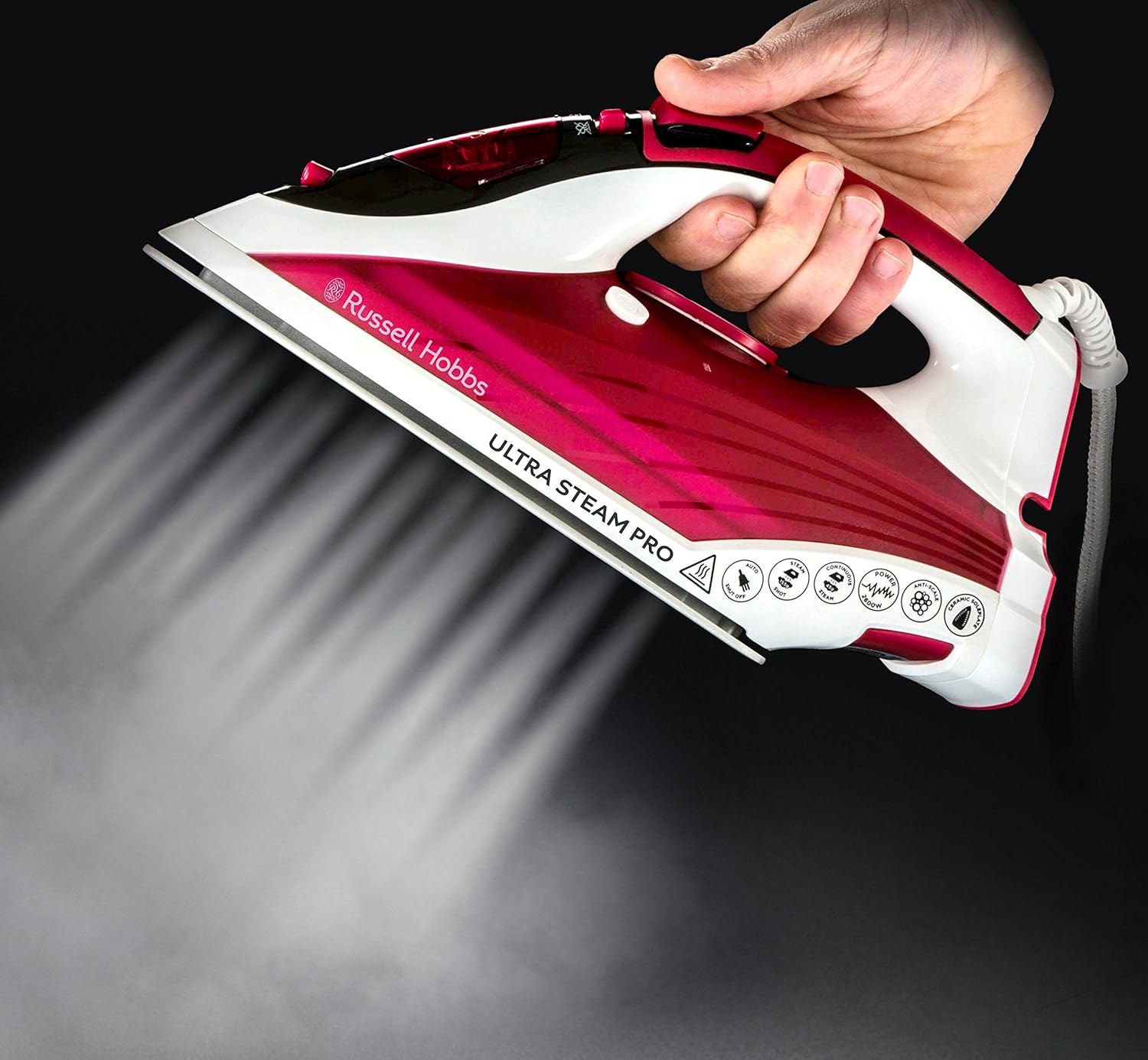 Russell Hobbs Supreme Steam traditional iron in red and white with steam output visible