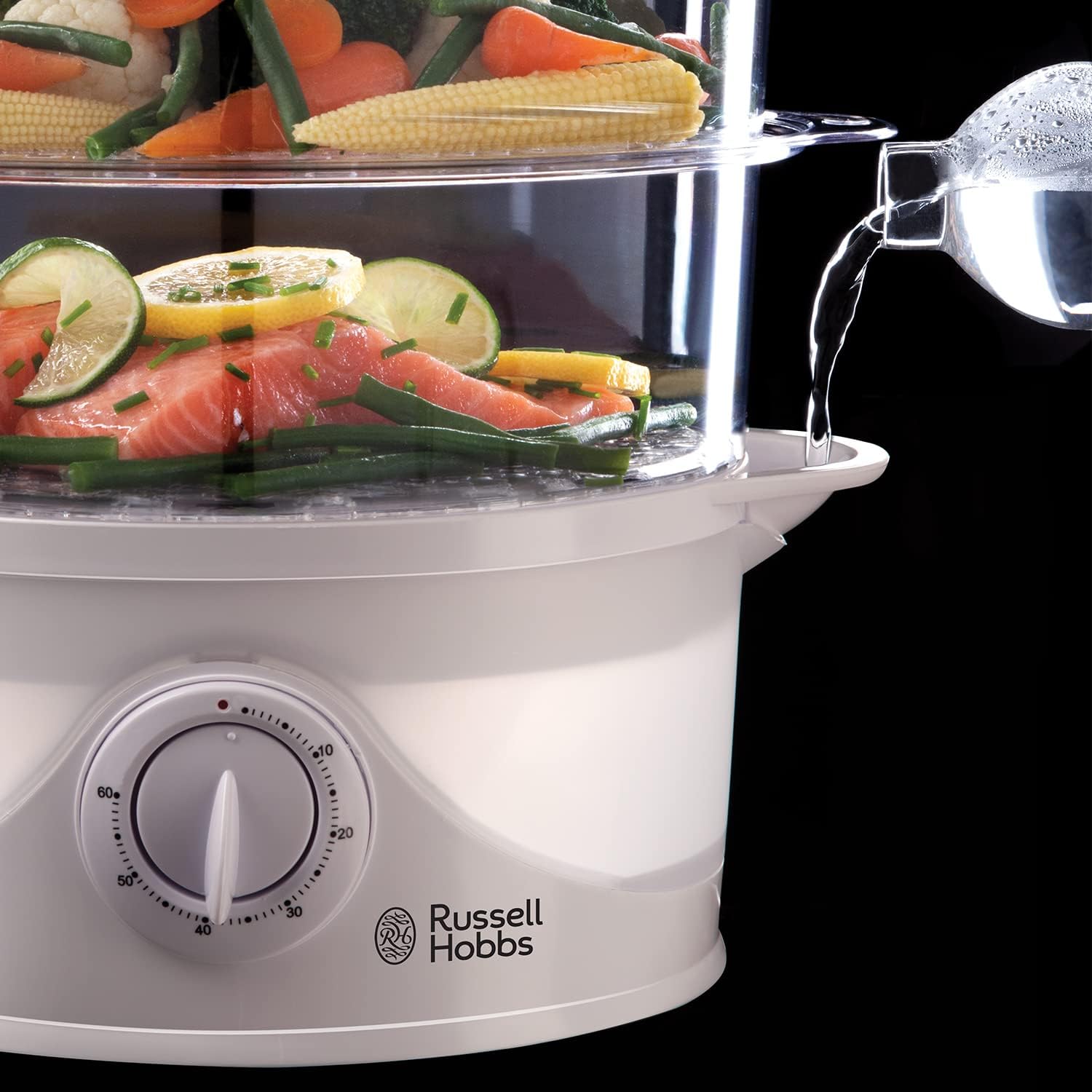 Russell Hobbs 21140 white three-tier food steamer with vegetables and water pouring