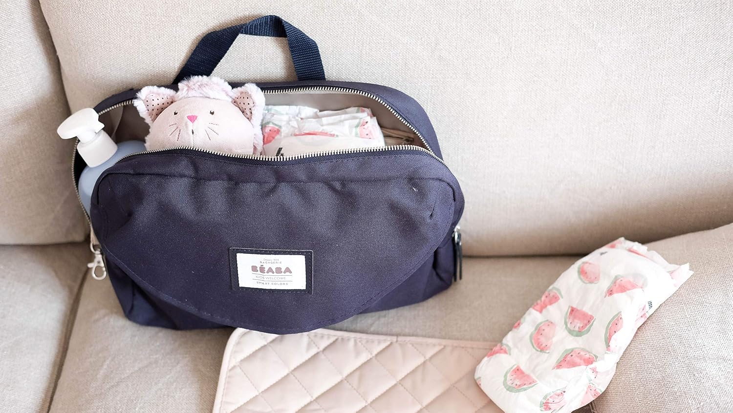 Béaba Geneva II changing bag in navy blue with handle and contents