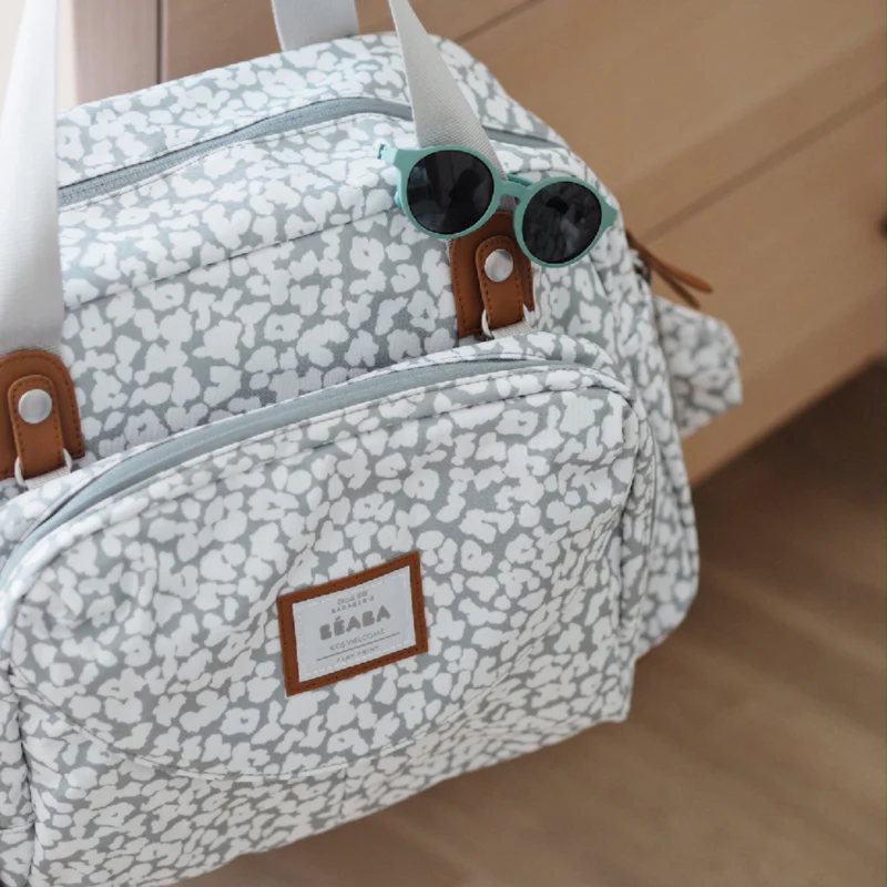 Béaba Geneva II changing bag 23L grey and white floral pattern with handles