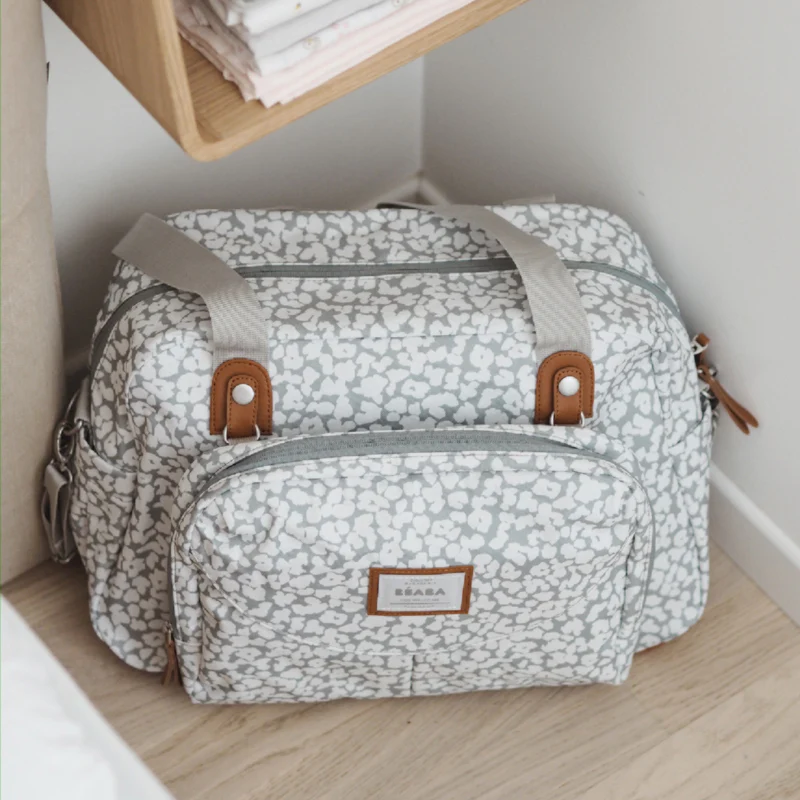 Béaba Geneva II changing bag 23L cherry blossom pattern with leather handles