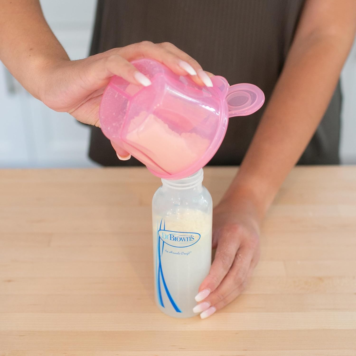 Dr. Brown's pink milk powder dispenser with storage compartments