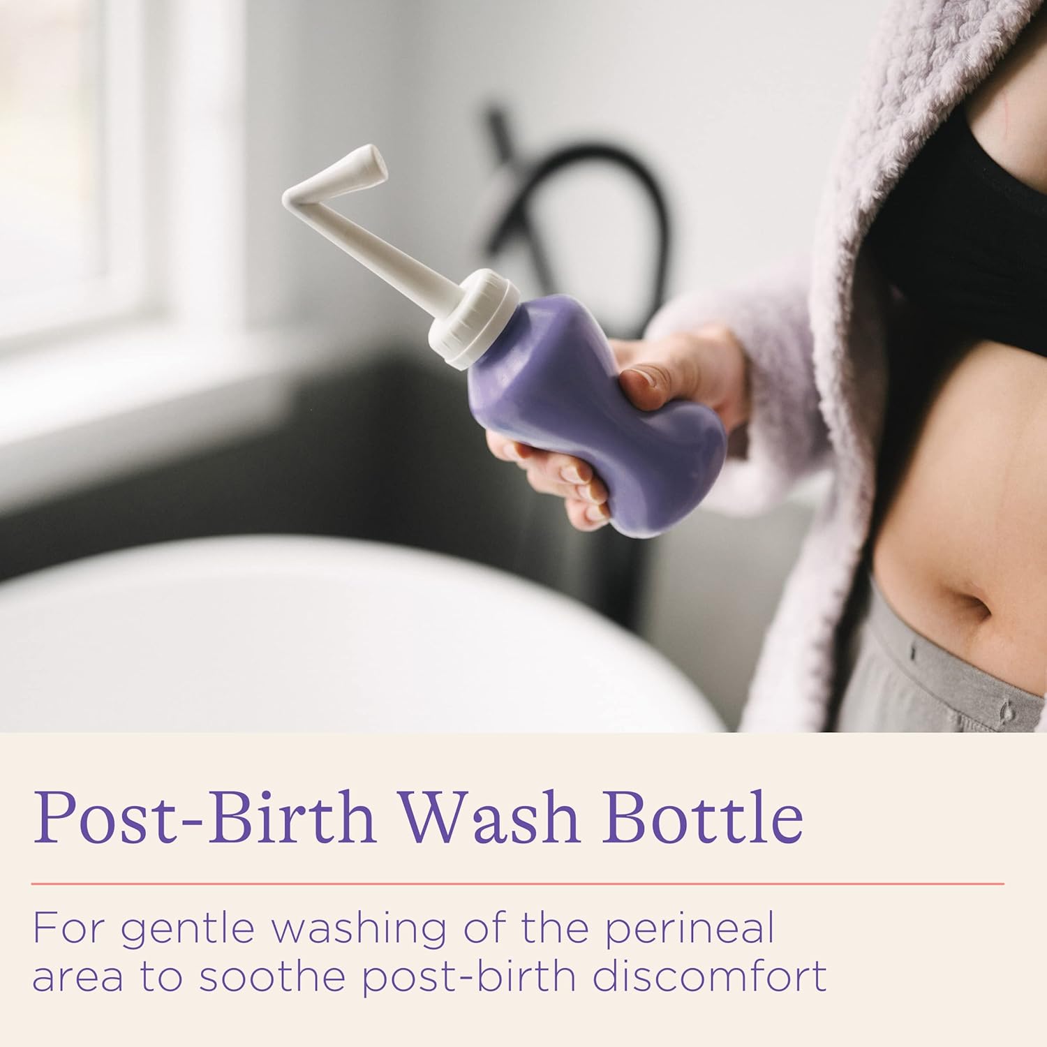 Lansinoh purple post-birth wash bottle with white nozzle for perineal care