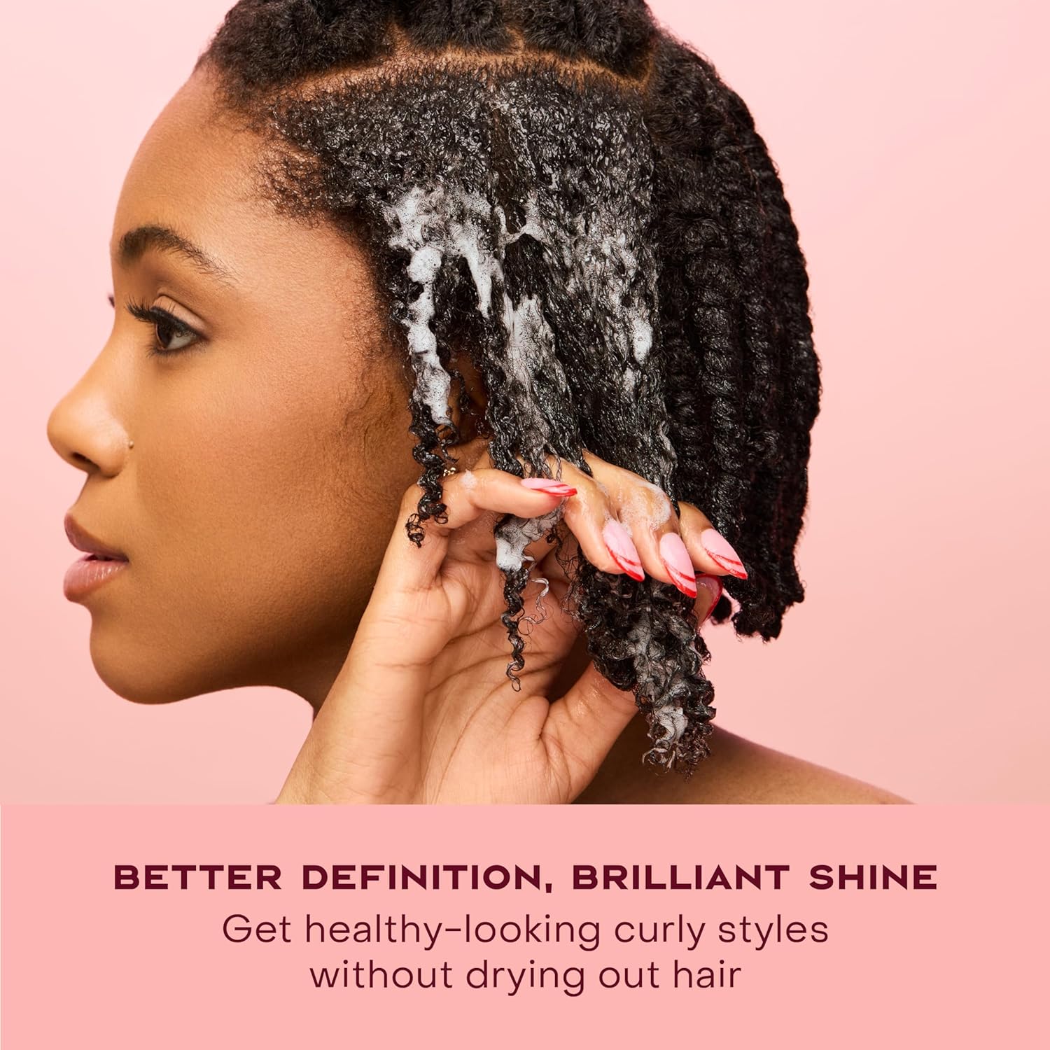 SheaMoisture Coconut and Hibiscus Frizz-Free Curl Mousse applied to curly hair