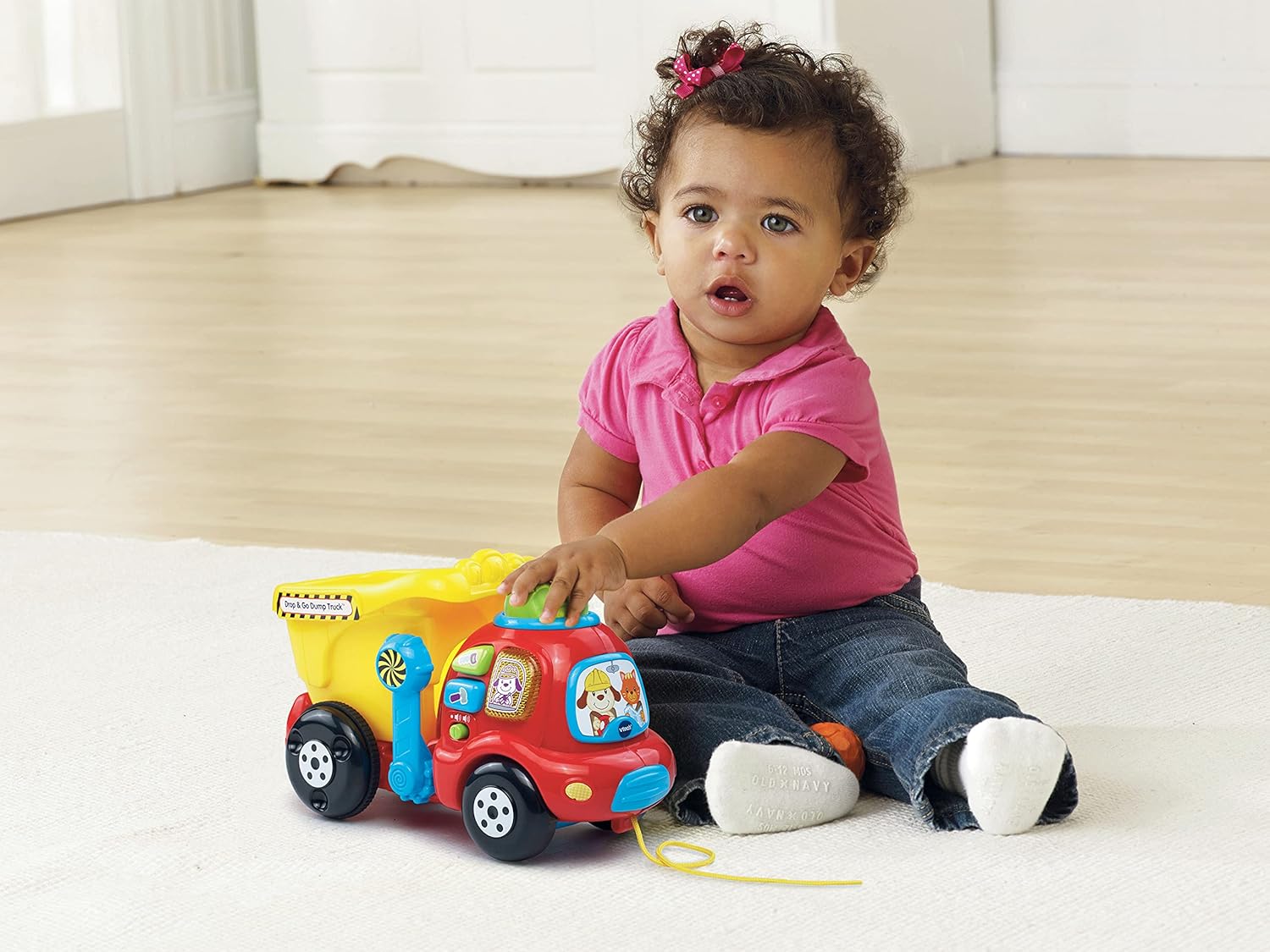 VTech Put & Take Dumper Truck in red, blue and yellow with interactive features