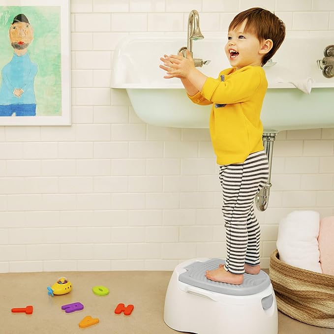 Munchkin Arm & Hammer 3-in-1 multi-stage potty seat in white with grey footrest