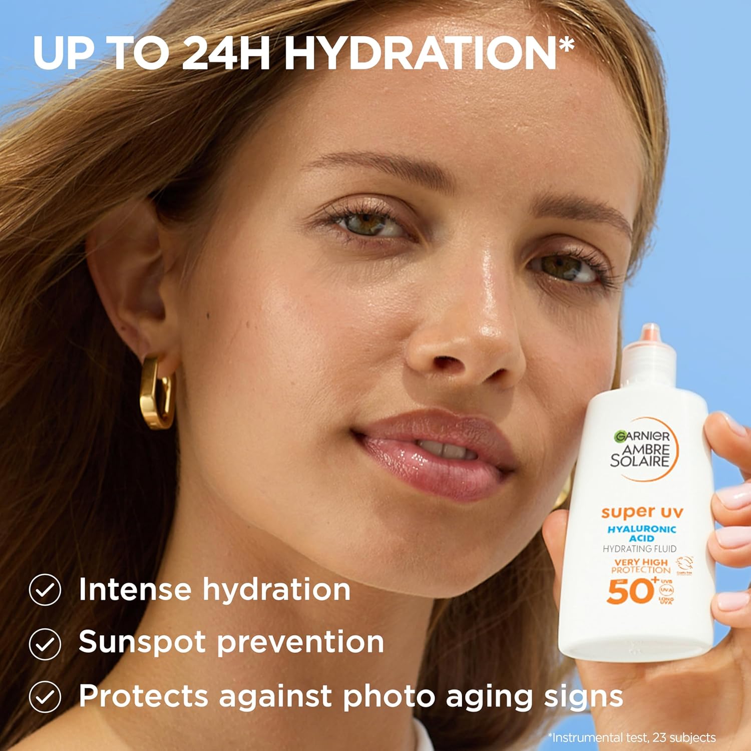 Garnier Ambre Solaire Super UV SPF 50+ white hydrating fluid bottle with orange text