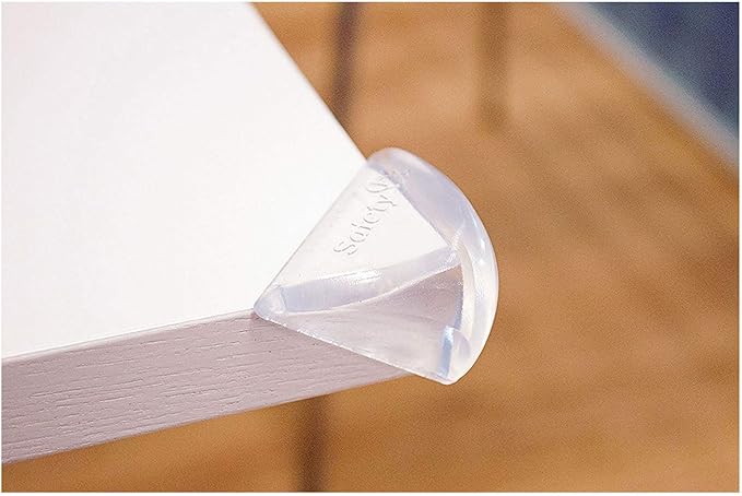 Safety 1st white soft corner guard fitted on table edge