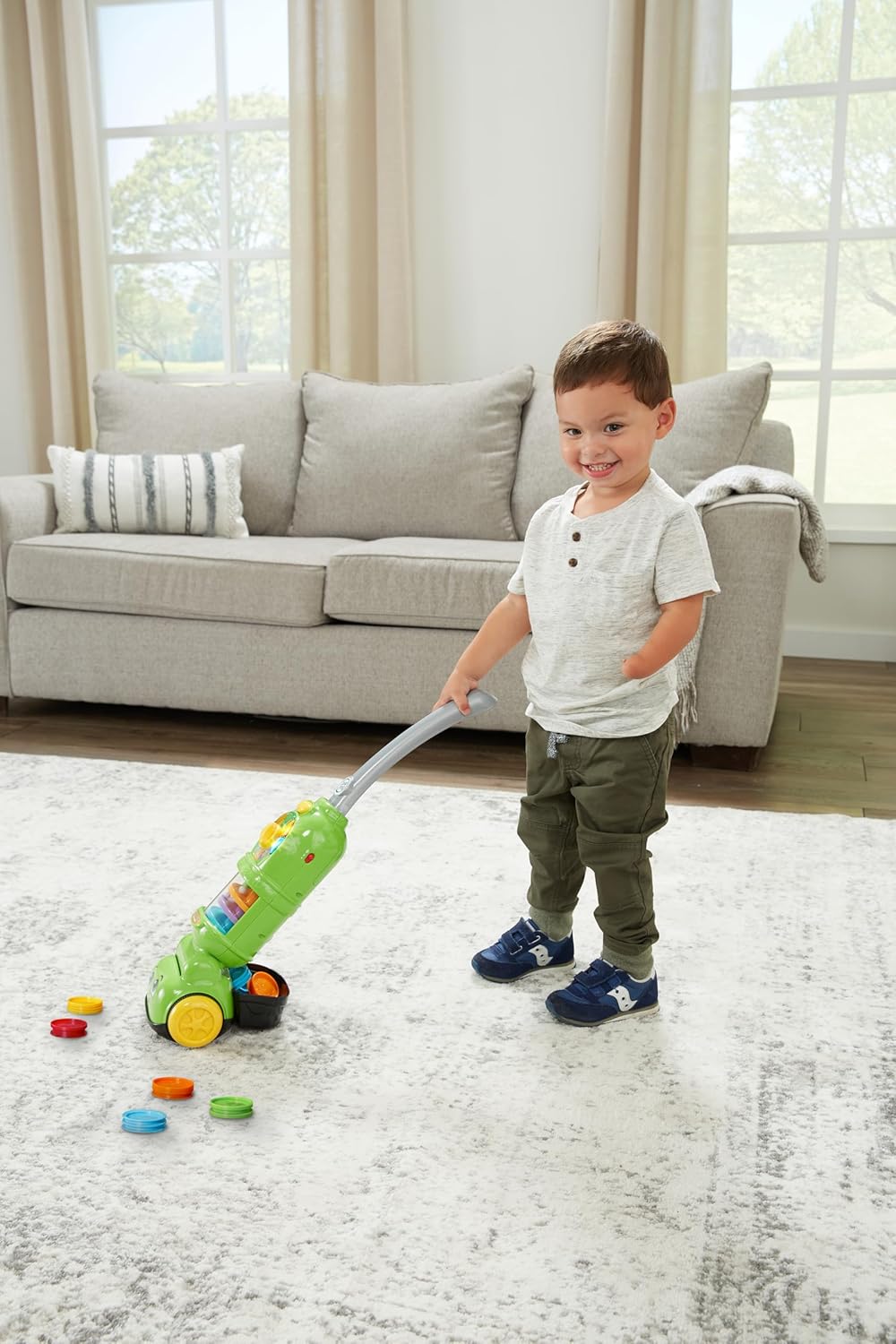 LeapFrog Pick Up & Count Vacuum green toy with colorful pieces