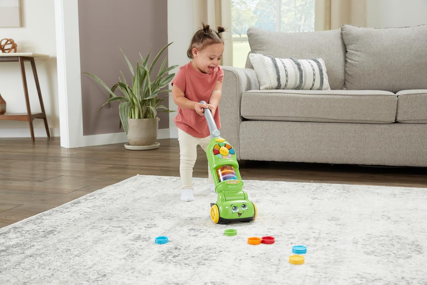 LeapFrog Pick Up & Count Vacuum toy in green with coloured discs