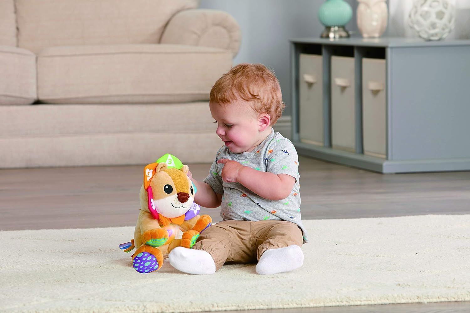 LeapFrog Lullaby Lights Lion soft toy with green leaf crown and colourful accents