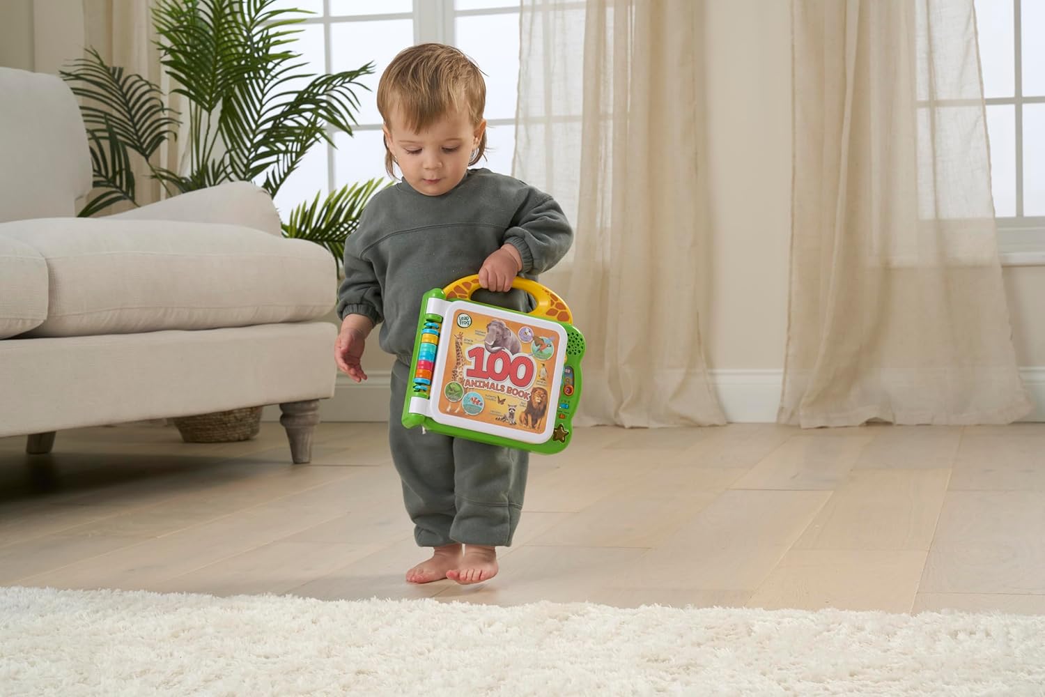 LeapFrog 100 Animals Book interactive learning toy with green case and handle