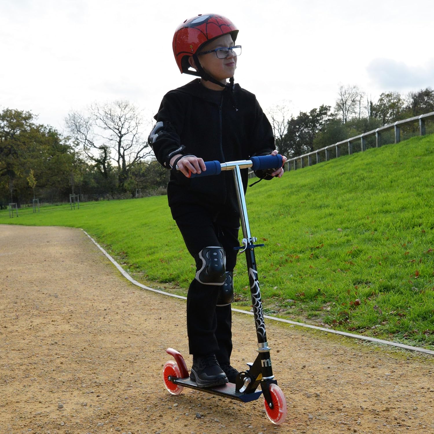 Marvel Spider-Man folding in-line scooter with red wheels and blue handlebar grips