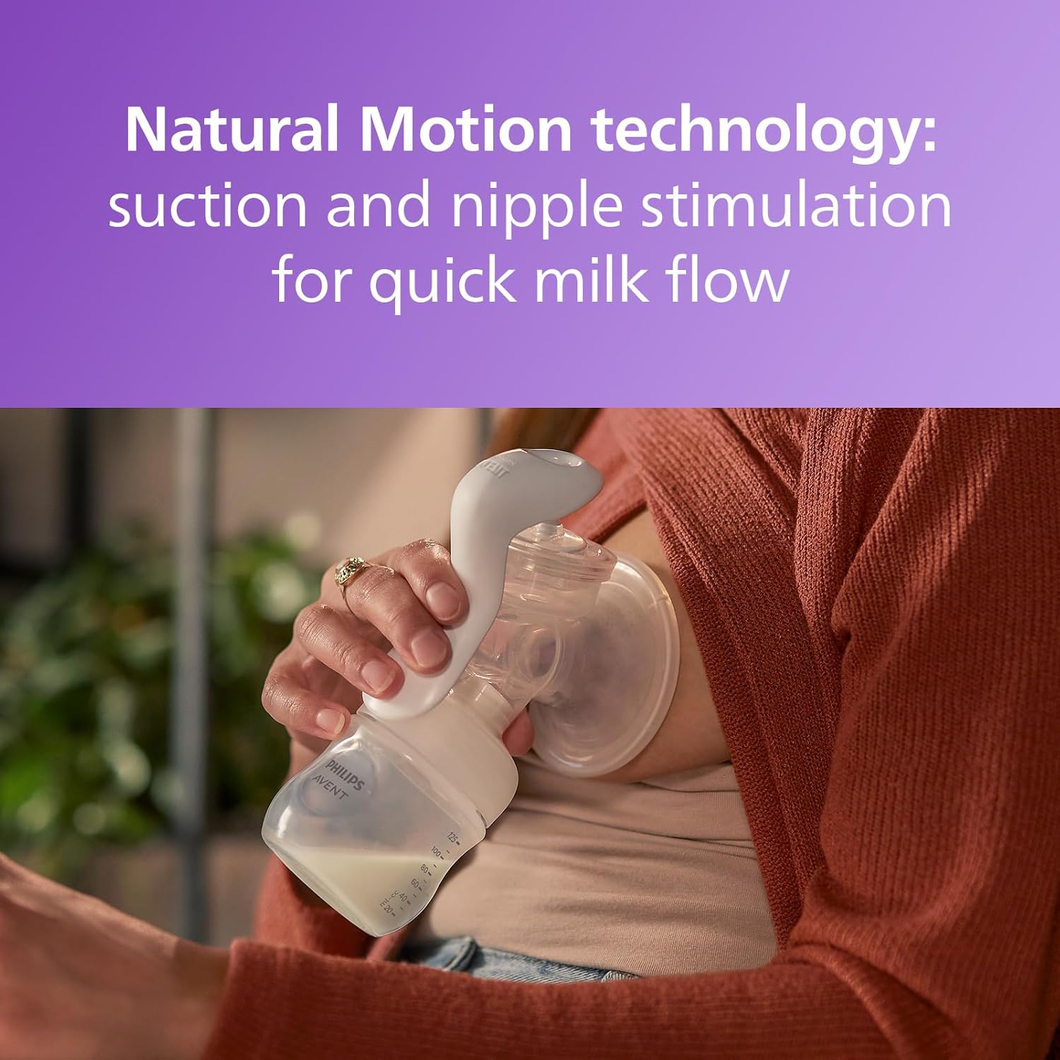 Philips Avent manual breast pump with collection bottle, white and clear design