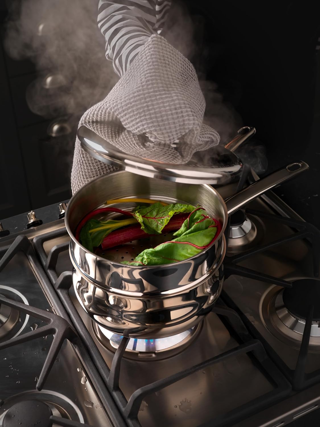 Stellar S1F5B stainless steel deep saucepan set on gas cooker with vegetables