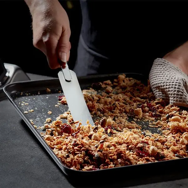Stellar hard anodised baking tray with granola and spatula