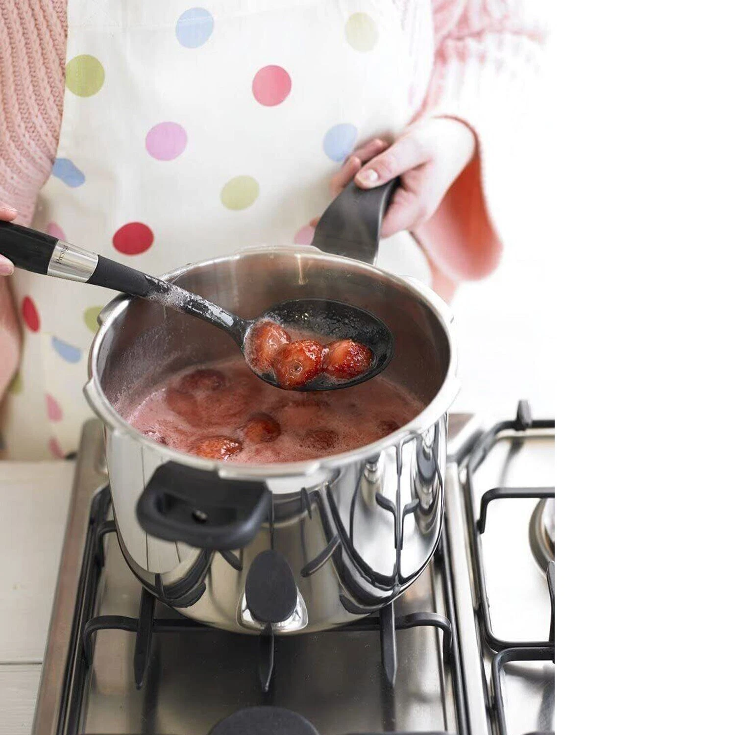 Prestige Smart Plus black stainless steel 6 litre pressure cooker in use on hob