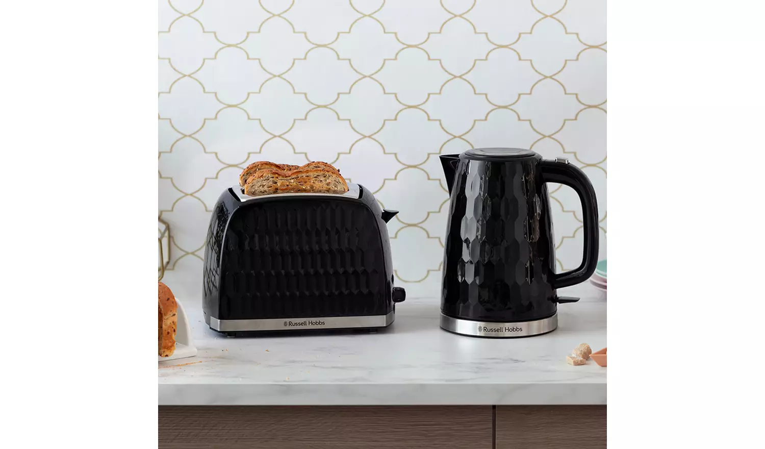 Russell Hobbs Honeycomb black two slice toaster with toasted bread showing