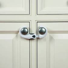 Clippasafe Home Safety Cabinet Lock with silver handles on white cabinet doors