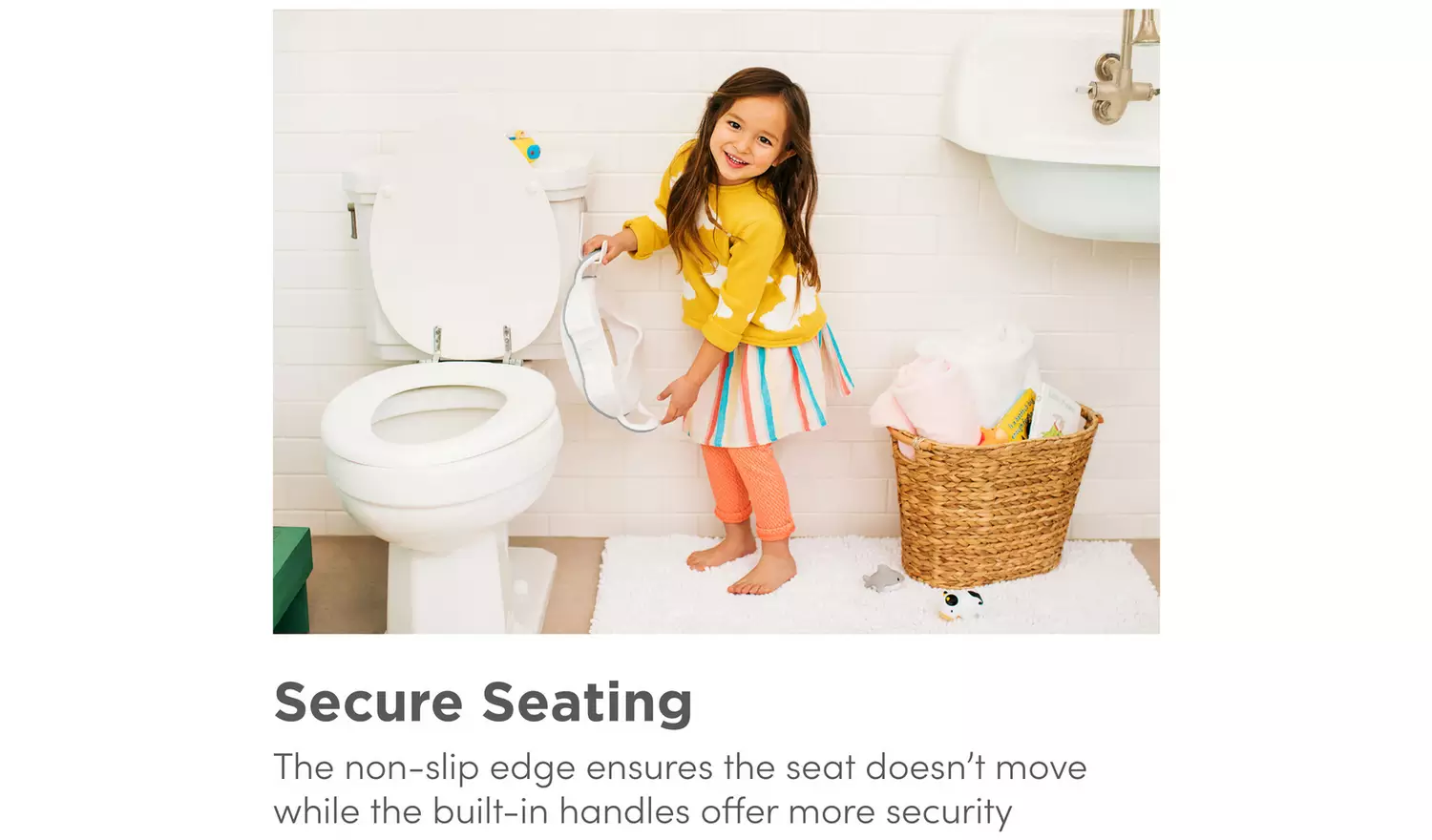 Munchkin white toilet trainer seat with built-in handles for children