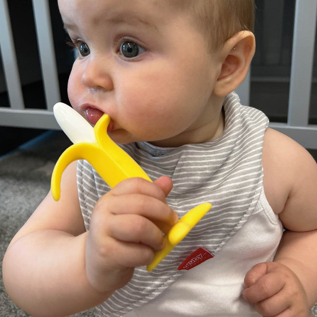 Nuby banana shaped yellow silicone teether for infants